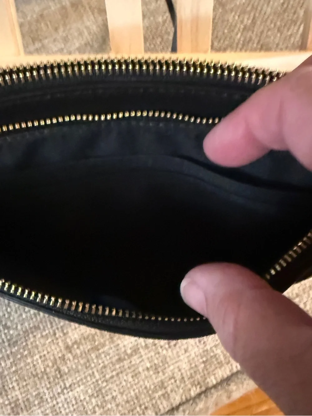 Coach Double Zip Wristlet crafted in black pebbled leather
